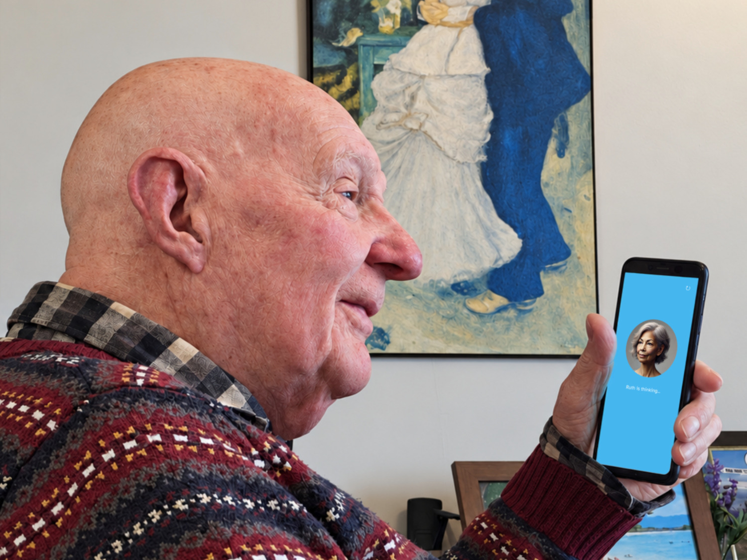 Tom Mackenzie, co-founder of Comfort Companions, speaking to Ruth, a digital companion, using his phone